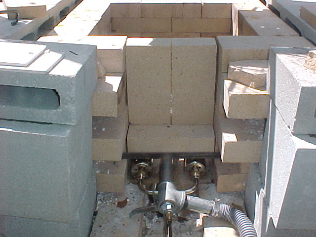 front of furnace showing stacked firebricks